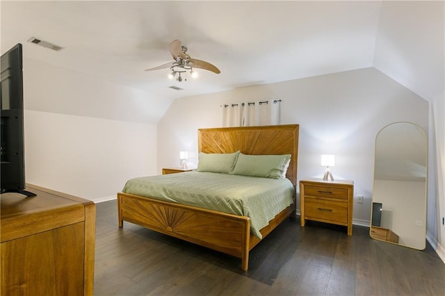 bedroom featuring visible vents, dark wood-type flooring, a ceiling fan, baseboards, and lofted ceiling