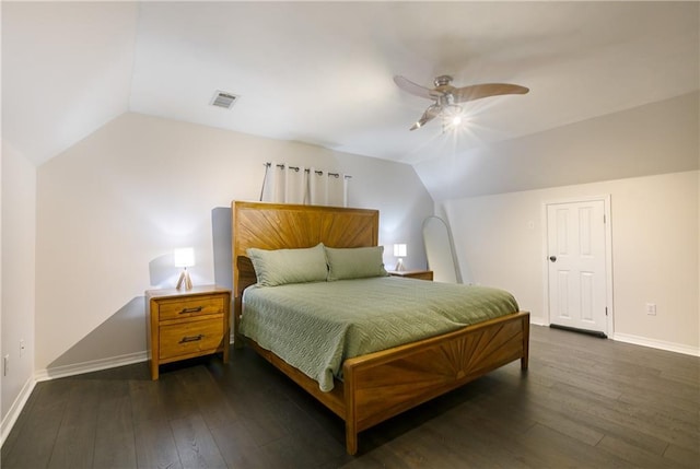 bedroom with visible vents, baseboards, dark wood-type flooring, and lofted ceiling