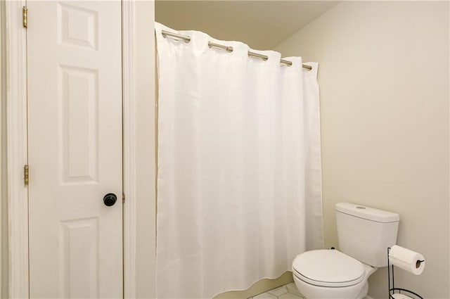 full bathroom with tile patterned floors and toilet