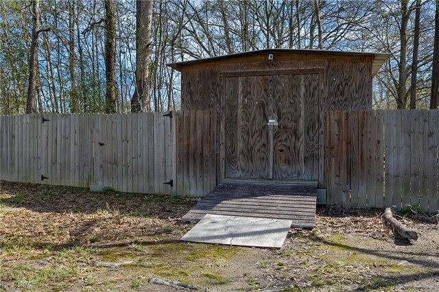 view of shed with a fenced backyard