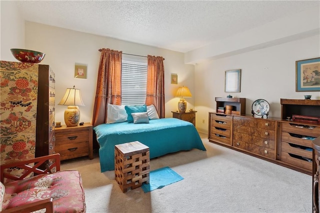 carpeted bedroom with a textured ceiling