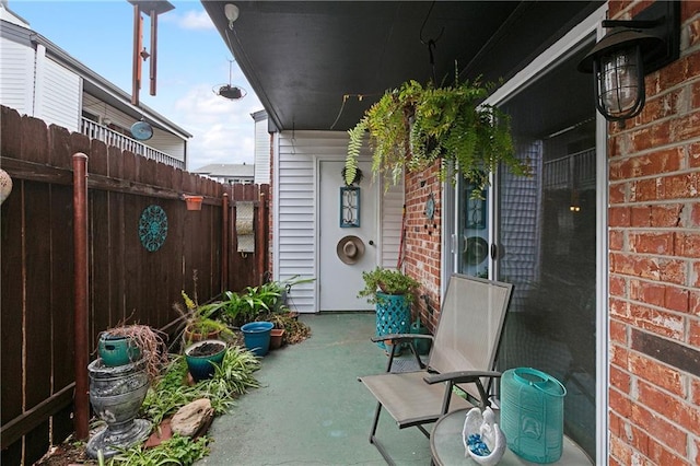 view of patio / terrace featuring fence