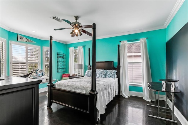 bedroom with multiple windows, baseboards, visible vents, and ornamental molding