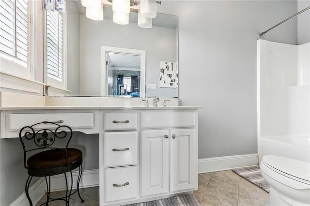 full bath featuring vanity, tile patterned floors, toilet, and baseboards