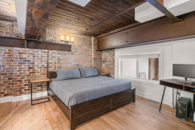 bedroom featuring wood finished floors, visible vents, brick wall, baseboards, and wooden ceiling