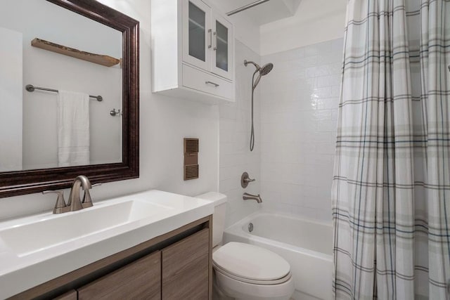 full bathroom featuring vanity, toilet, and shower / tub combo