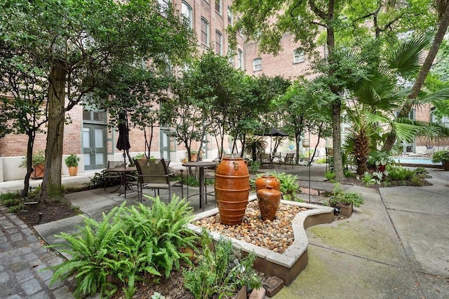 surrounding community featuring a patio area