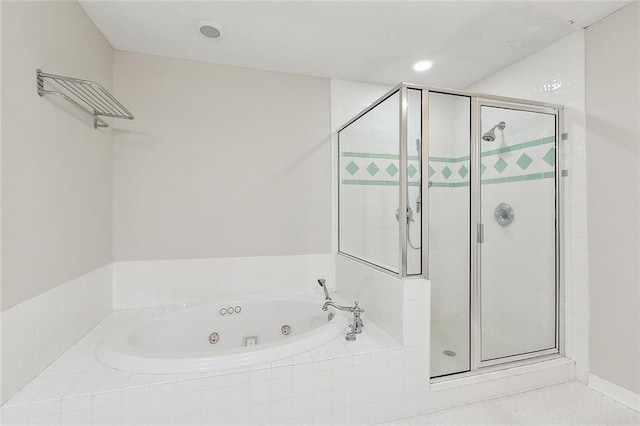 full bath featuring a tub with jets and a stall shower