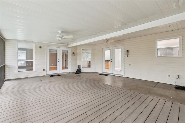 wooden terrace featuring french doors and ceiling fan