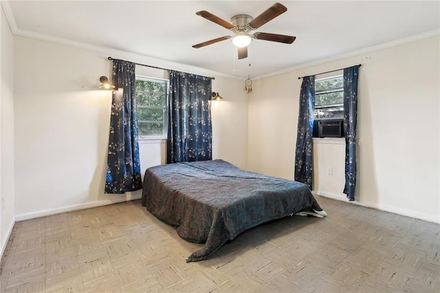 bedroom featuring crown molding, cooling unit, baseboards, and ceiling fan