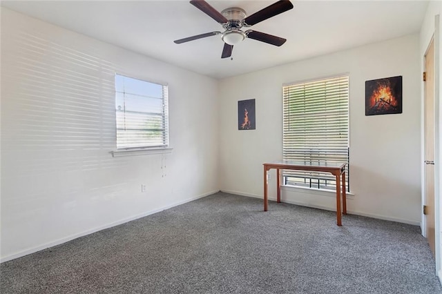 unfurnished room with ceiling fan, baseboards, and carpet floors