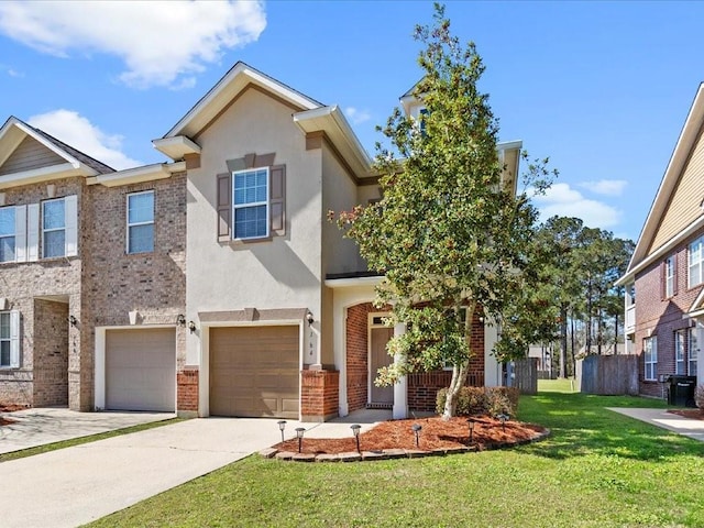 view of property featuring stucco siding, driveway, a front lawn, an attached garage, and brick siding