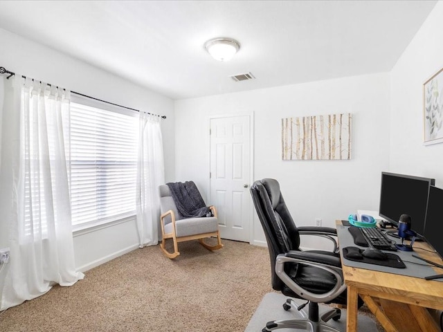 office space with visible vents, baseboards, and carpet