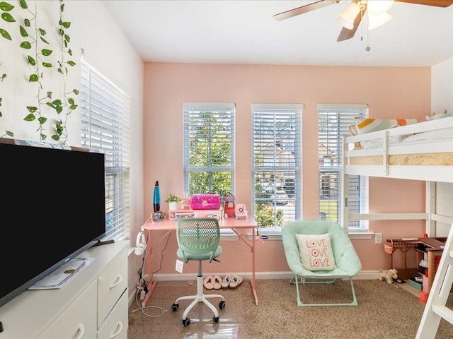 bedroom featuring multiple windows, speckled floor, baseboards, and ceiling fan