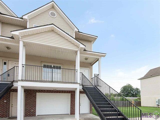 1500 Brightside Dr Unit D6, Baton Rouge, LA 70820 - townhome / multi-family property featuring stairway, brick siding, covered porch, and a garage