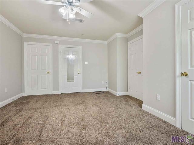 1500 Brightside Dr Unit D6, Baton Rouge, LA 70820 - unfurnished bedroom featuring crown molding, baseboards, and carpet floors