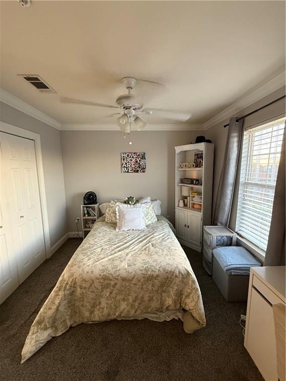 1500 Brightside Dr Unit D6, Baton Rouge, LA 70820 - bedroom featuring visible vents, dark carpet, a ceiling fan, and ornamental molding