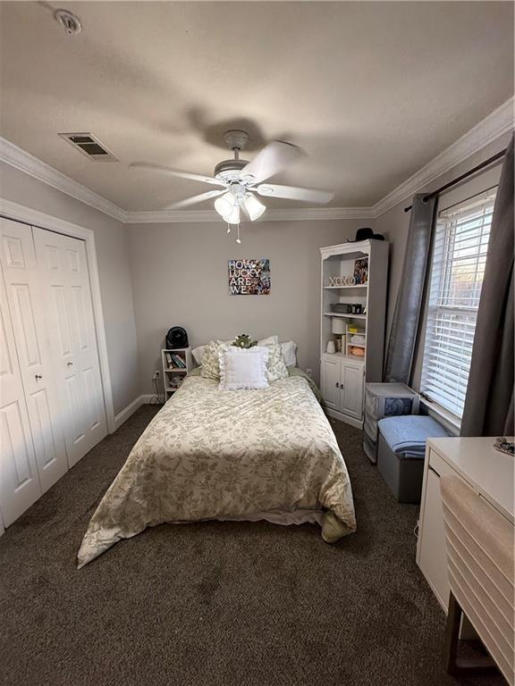 1500 Brightside Dr Unit D6, Baton Rouge, LA 70820 - bedroom with ceiling fan, visible vents, dark colored carpet, and ornamental molding