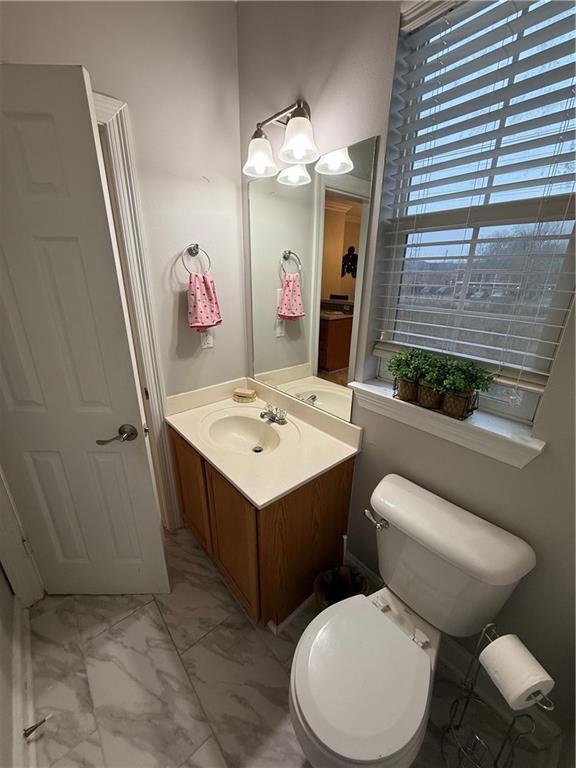 1500 Brightside Dr Unit D6, Baton Rouge, LA 70820 - bathroom featuring marble finish floor, toilet, and vanity