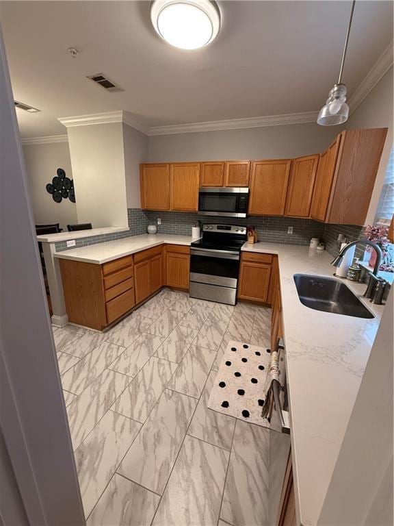 1500 Brightside Dr Unit D6, Baton Rouge, LA 70820 - kitchen featuring a sink, ornamental molding, light countertops, stainless steel appliances, and marble finish floor