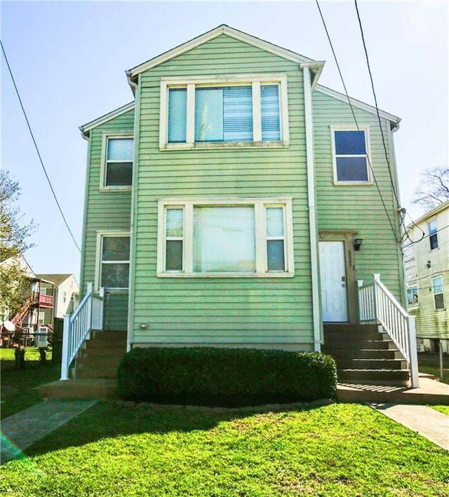 view of front of property with a front lawn