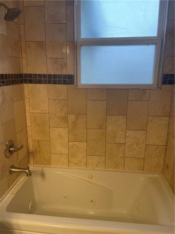 full bath with a combined bath / shower with jetted tub