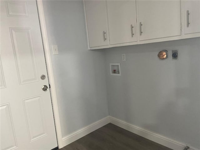 washroom with baseboards, cabinet space, electric dryer hookup, washer hookup, and dark wood-type flooring