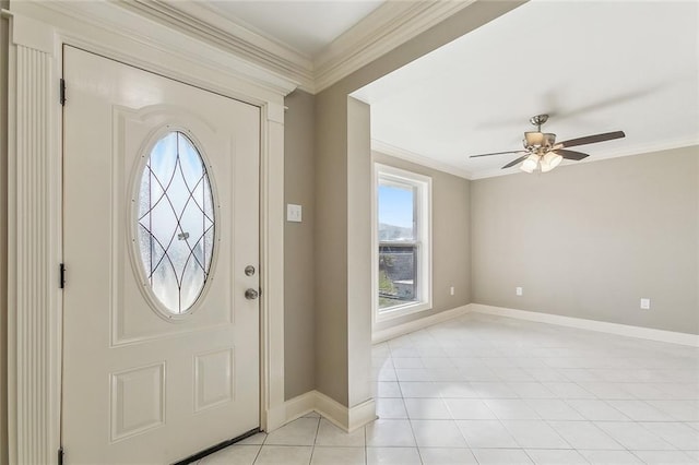 foyer entrance with light tile patterned flooring, a ceiling fan, baseboards, and ornamental molding