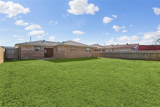 view of yard with a fenced backyard