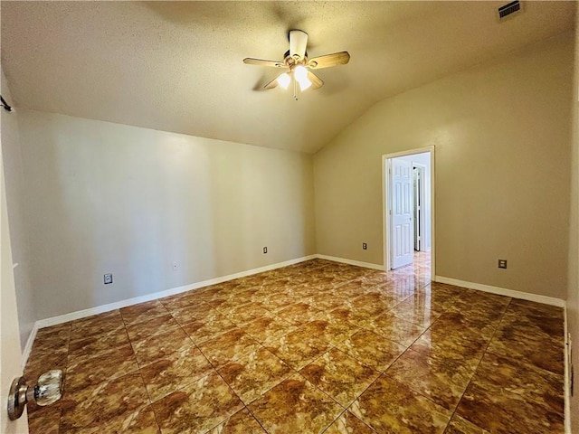 additional living space with a ceiling fan, visible vents, baseboards, lofted ceiling, and a textured ceiling