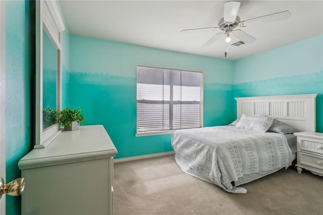 bedroom featuring visible vents, carpet floors, baseboards, and ceiling fan