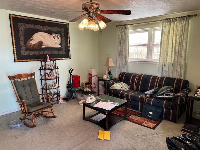 carpeted living room featuring a ceiling fan and a textured ceiling