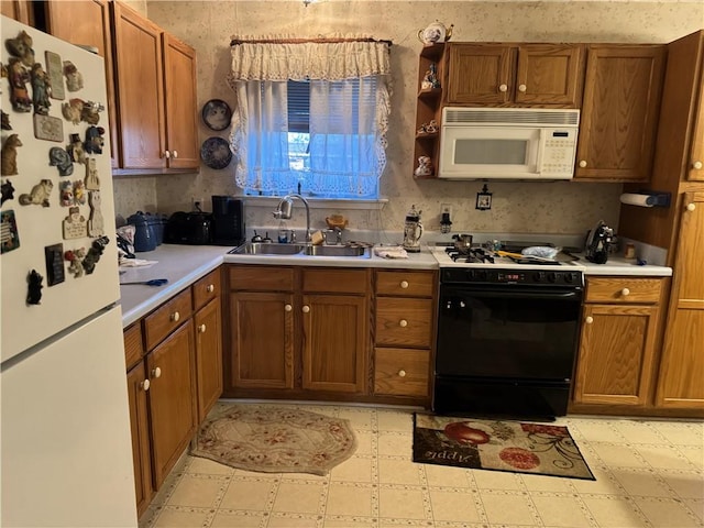 kitchen with white appliances, light floors, a sink, light countertops, and brown cabinets