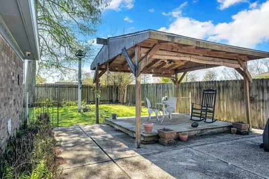 view of patio featuring a deck and a fenced backyard