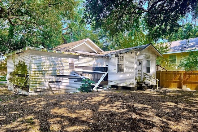 6901 Catina St, New Orleans, LA 70124 - back of property with entry steps and fence