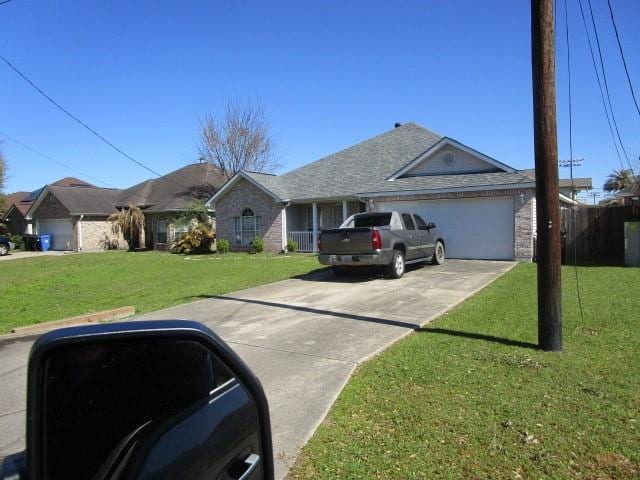 single story home with a garage, concrete driveway, and a front lawn