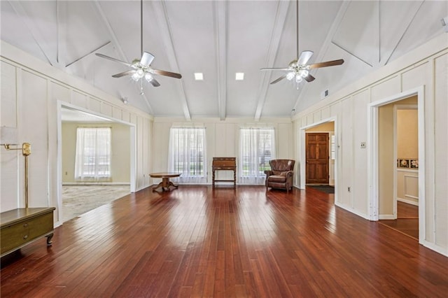 unfurnished room featuring wood-type flooring, a ceiling fan, and a decorative wall