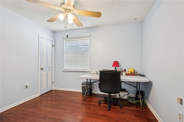 office space with ceiling fan, a textured ceiling, baseboards, and wood finished floors