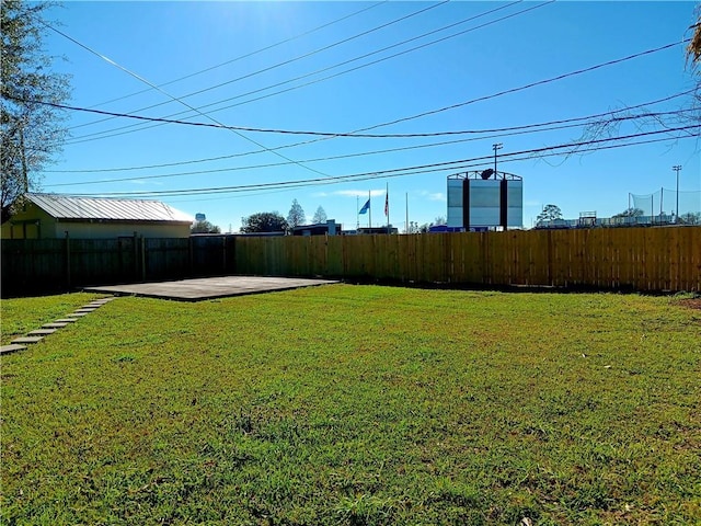 view of yard with a patio area and a fenced backyard