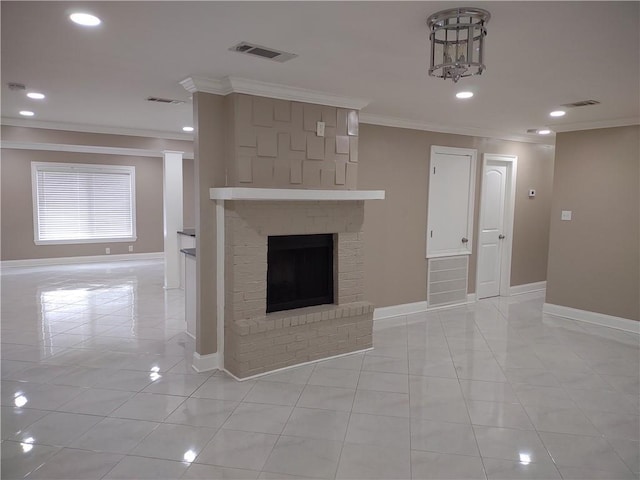 unfurnished living room featuring visible vents, a brick fireplace, crown molding, and baseboards