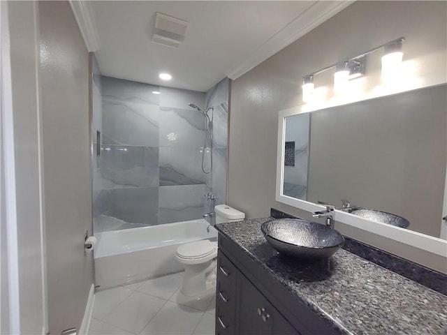 bathroom featuring tile patterned flooring, crown molding, toilet, bathtub / shower combination, and vanity