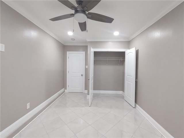 unfurnished bedroom featuring a ceiling fan, a closet, crown molding, light tile patterned floors, and baseboards