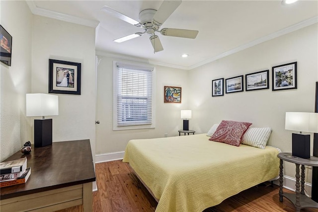 bedroom featuring ceiling fan, baseboards, ornamental molding, recessed lighting, and wood finished floors