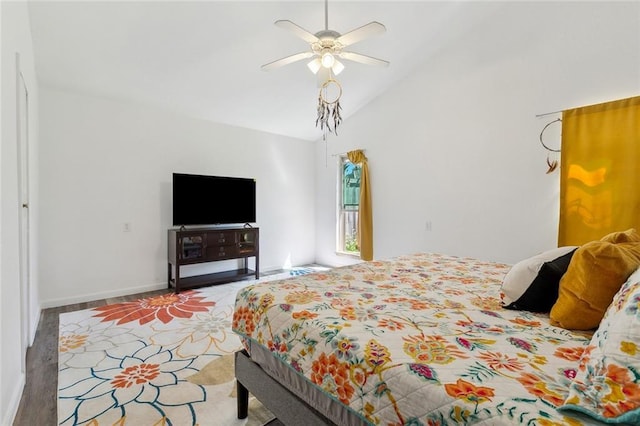 bedroom featuring carpet, lofted ceiling, a ceiling fan, and baseboards