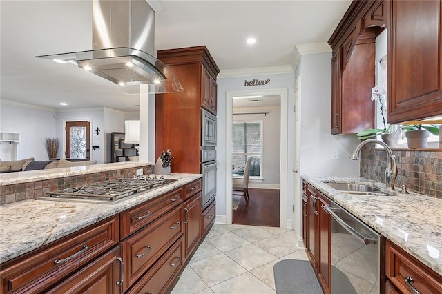 kitchen featuring tasteful backsplash, ornamental molding, light stone counters, appliances with stainless steel finishes, and a sink