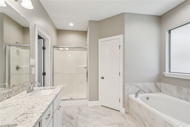 bathroom featuring vanity, baseboards, a stall shower, a bath, and marble finish floor