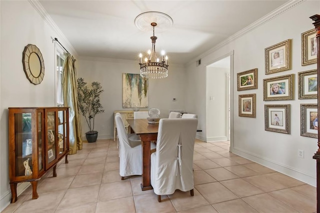 dining room featuring crown molding, a notable chandelier, light tile patterned flooring, and baseboards