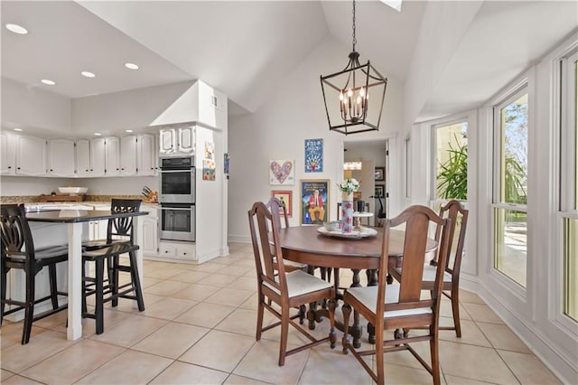 dining room with vaulted ceiling, light tile patterned floors, recessed lighting, and a chandelier