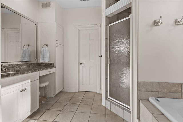 full bathroom with vanity, visible vents, tile patterned flooring, a shower stall, and a bath