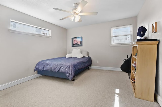 bedroom featuring baseboards and a ceiling fan